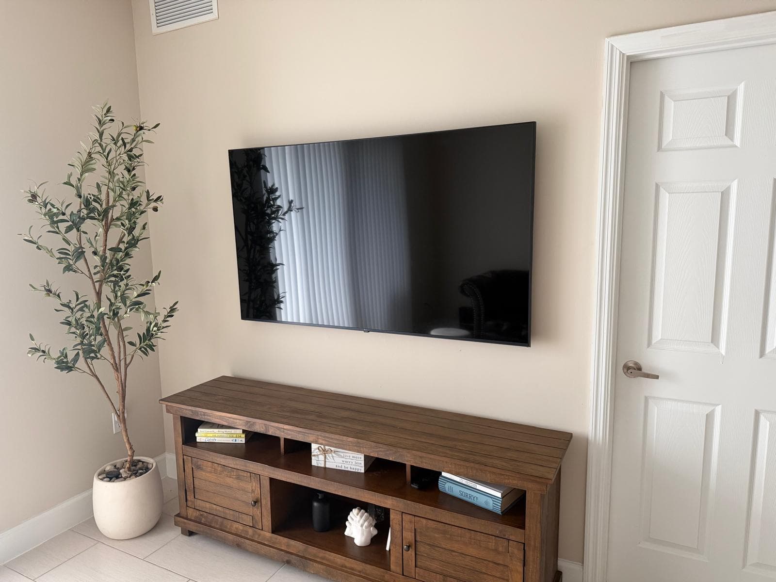 Professional TV wall mount installation in a modern living room