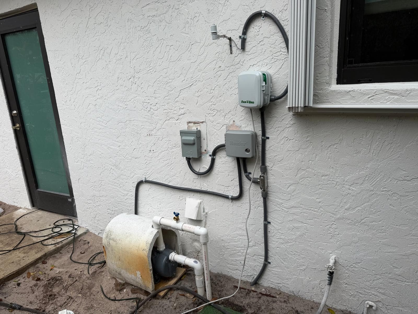 Sprinkler system pump and controller setup showing irrigation system not working at a Miami home